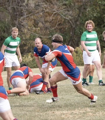 Ashby carrying the ball in a rugby match